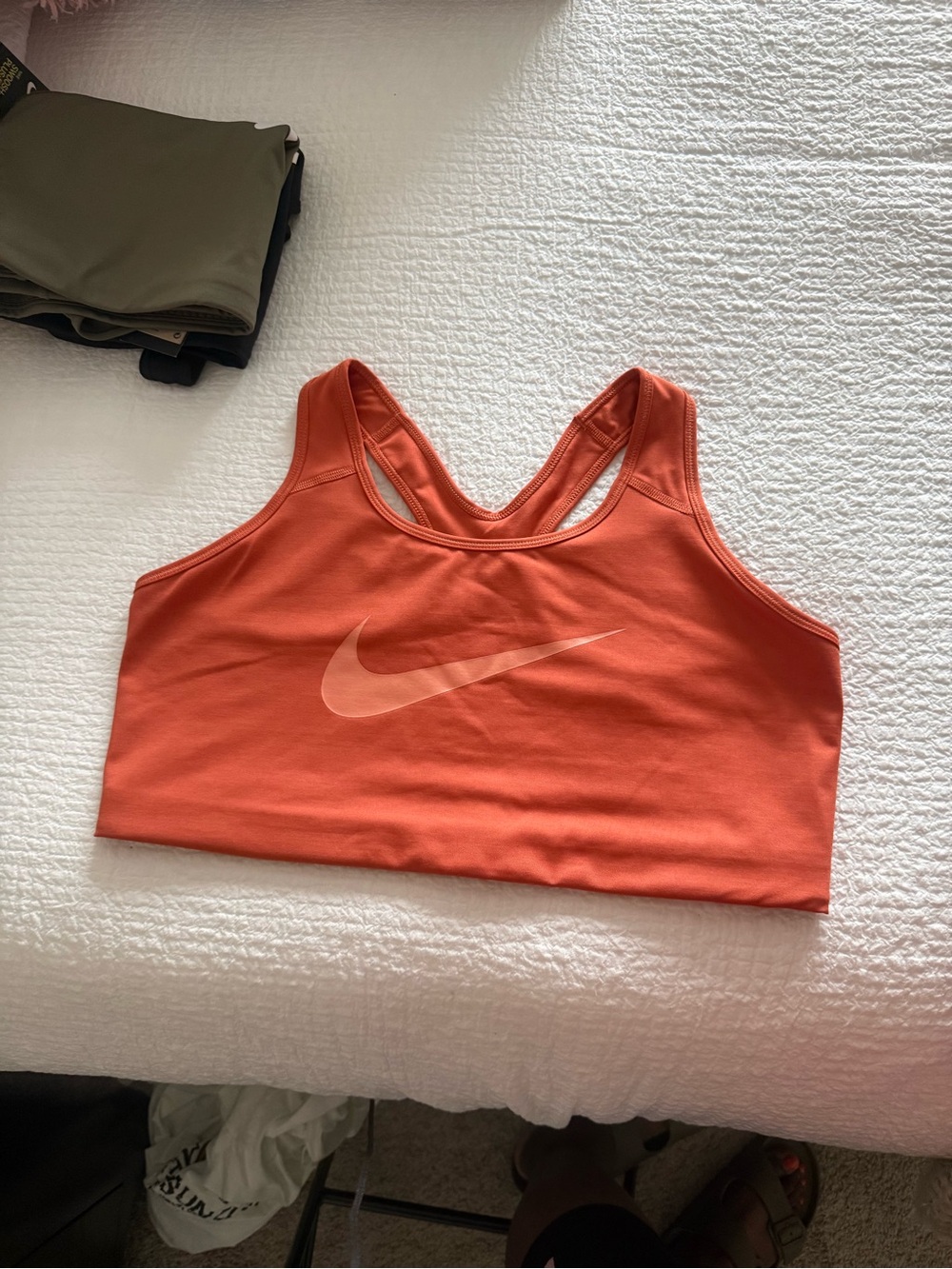 Nike Women's Coral-Orange Racerback Sports Bra with Swoosh